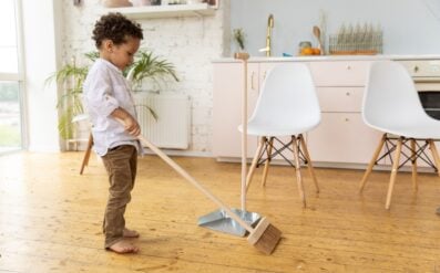 5 year old sweeping the floor